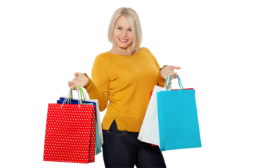 Totebag shopper. Shopping woman holding many tote bags excited isolated on white.