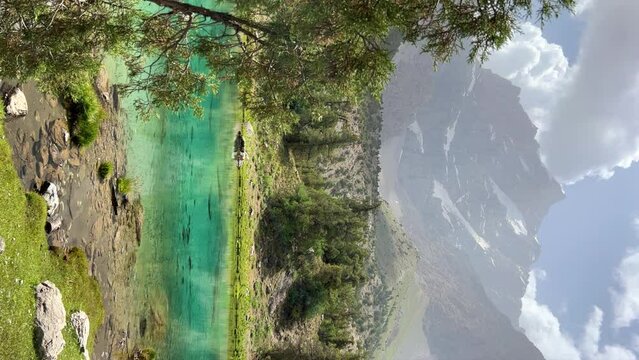 The Alaudin (Chapdara) lakes, lying at an altitude of 2800 m, are considered one of the most beautiful lakes of the Fan Mountains. Turquoise mountain lake. Pamiro-Alai. Tajikistan, Pamir 4K