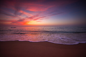 Beach sunrise over the tropical sea shore