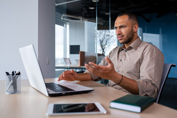 Upset frustrated businessman looking at laptop window, man received online notification message with bad achievement results, workplace error.