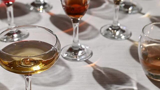 Glasses with different wine types on the table, wine tasting, party and celebration concept.
