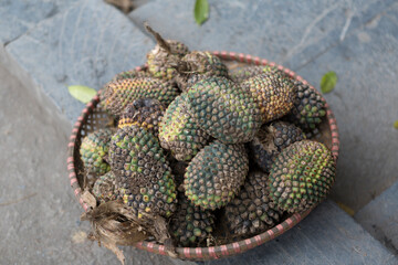 Vietnam basket of pineapples on a cloudy spring day