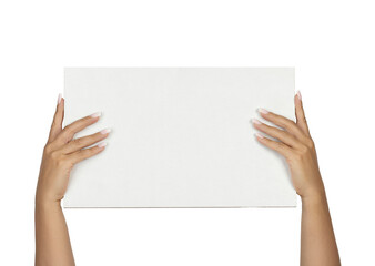 Adult female hands with long square ombre manicured nails, holding up a rectangular white board with copy space. Isolated on a white background. © Nynke