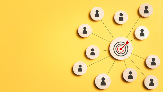 Customer relationship management concept. wooden block with target icon linked with human icons for customer focus group. Data exchanges development and customer service.