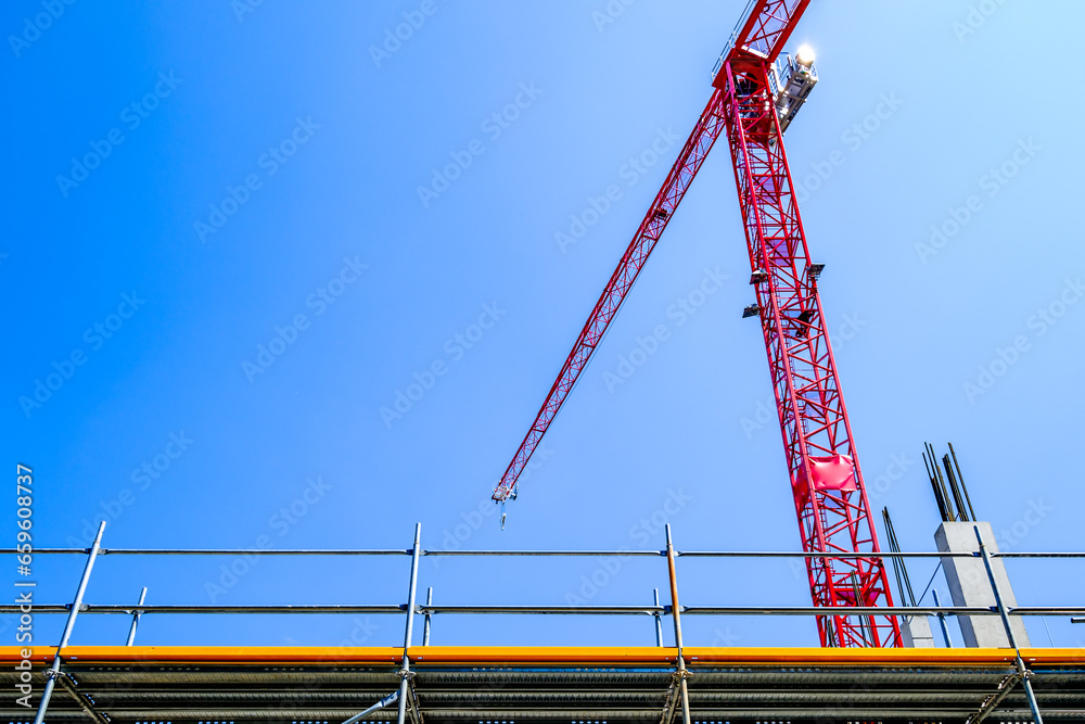 Wall mural modern crane at a construction site