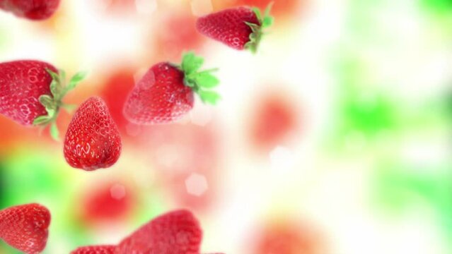Fruit and berries tossed in the air and falling down in slow motion. Clear water splash and water droplets. Fresh strawberries with green leaves falling down in slow motion