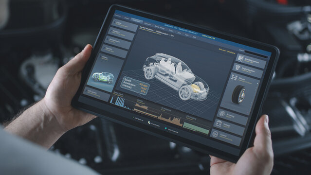Male technician holds digital tablet computer. Simulation of real-time car diagnostics and aerodynamics testing displayed on screen. 3D animation of software with 3D virtual electric vehicle model.
