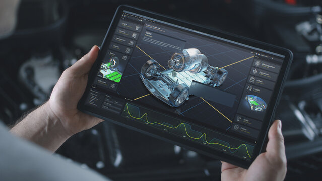 Male automotive engineer holds digital tablet computer with simulation of real-time car diagnostics or developing displayed on screen. 3D render of program with 3D virtual electric vehicle prototype.