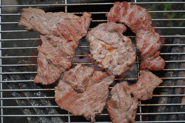 Grilled pork on a rustic stove. Grilled pork. Grilled pork belly.
