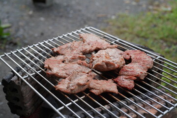 Grilled pork on a rustic stove. Grilled pork. Grilled pork belly.