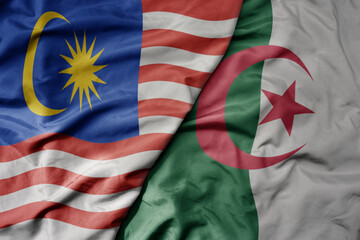 big waving realistic national colorful flag of malaysia and national flag of algeria .