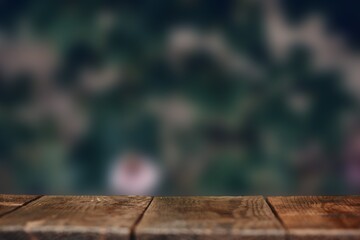 Wooden surface on the background of a blurred backdrop