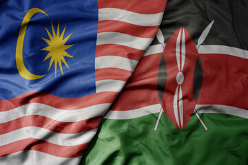 big waving realistic national colorful flag of malaysia and national flag of kenya .