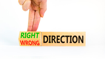 Right or wrong direction symbol. Concept words Right direction Wrong direction on wooden blocks....