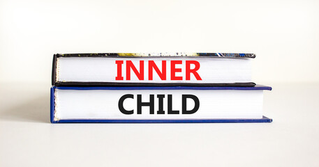 Inner child symbol. Concept words Inner child on beautiful books. Beautiful white table white background. Psychological, motivational inner child concept. Copy space.