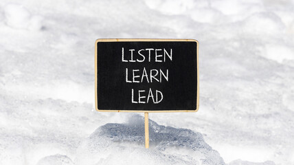 Listen learn lead symbol. Concept word Listen Learn Lead on beautiful black chalk blackboard. White snow. Beautiful white snow background. Business education listen learn lead concept. Copy space