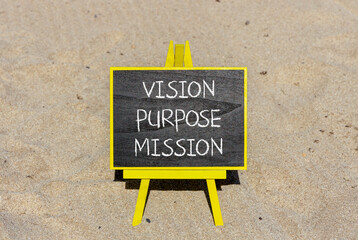 Vision purpose mission symbol. Concept word Vision Purpose Mission on beautiful black blackboard. Beautiful sand beach background. Business motivational vision purpose mission concept. Copy space.