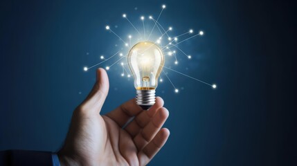 Innovative idea in businessman hand lightbulb 