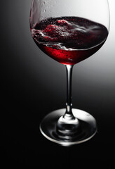 Closeup of red wine pouring.