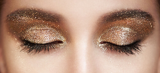 Female Eye with Extreme Long False Eyelashes. Eyelash Extensions. Makeup, Cosmetics, Beauty. Close...