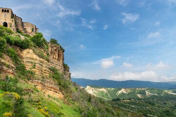 Fototapeta na wymiar Panoramic view of Bagnoregio, Italy on top of a hill also called -dying village- because the hill eroding, causing the village houses to collapse into the gorge