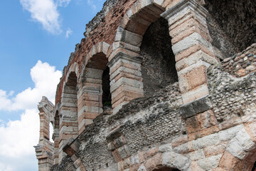 Fototapeta na wymiar Low angle view of part of the ancient Verona Arena which is a Roman amphitheatre in Piazza Bra in Verona, Italy built in 30 AD
