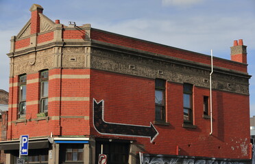 Red brick building from the 1900s at the Brunswick and Rose Streets corner in Federation style, Fizroy suburb. Melbourne-Australia-998