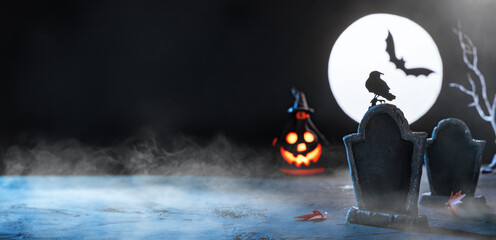 Halloween banner. Tombstone in a cemetery. Scary cemetery in fog at night by the light of the moon,...