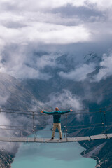 Obraz premium The Olpererhütte Bridge is a testament to human ingenuity and harmonizes with the ethereal charm of the mountains.