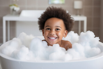 Soap foam, bath time, little african American child boy taking bubble bath in beautiful bathroom, Kids hygiene, Shampoo, hair treatment and soap for children, Kid bathing in large tub , foam in hair