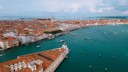 Fototapeta na wymiar Venice, when viewed from above, is a mesmerizing and unique cityscape that captivates the imagination. This iconic Italian city, often referred to as the 