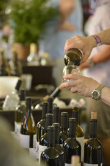 Man pouring glass of red wine