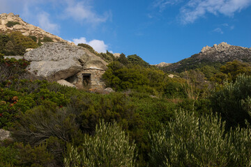 Hidden anti pirate stone house with rock shelter in the mountains of the north aegean island of...