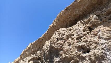 A canopy made of stone is a natural phenomenon standing hanging over the beach in Lisbon, an unusual phenomenon