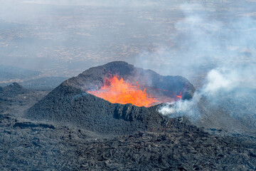 Close up view of spatter cone with lava of fissure near Litli-Hrútur Hill during the 2023 eruption near the mountain Fagradalsfjall, Iceland volcano area 