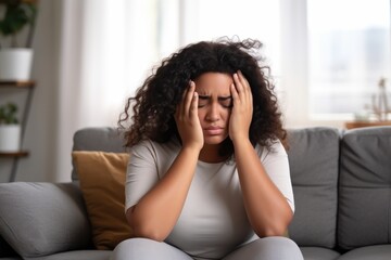Overweight young woman suffering from headache - obrazy, fototapety, plakaty