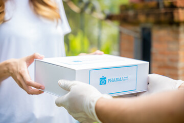 Delivery man give medicine drug to patient female at home, Sick Asian young woman receive...