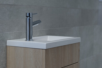 Bathroom tap, chrome faucet and vase, tiled walls, restroom sink, interior design