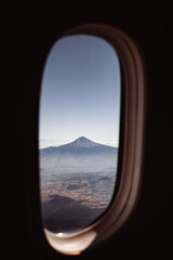 The mountain from the porthole of the plane.