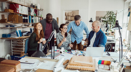 Group of people working together on a project in a startup company office