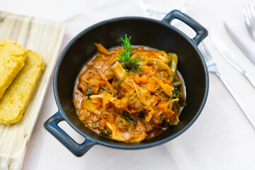 Popular dish of Lombard cuisine in Italy is Cassoeula, traditionally served with polenta