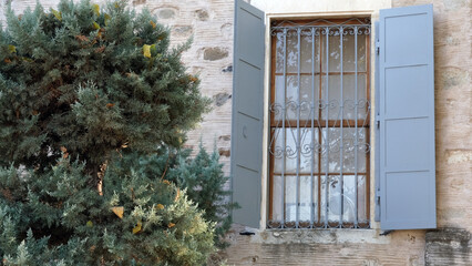 Fototapeta na wymiar A beautiful window detail with blue shutters