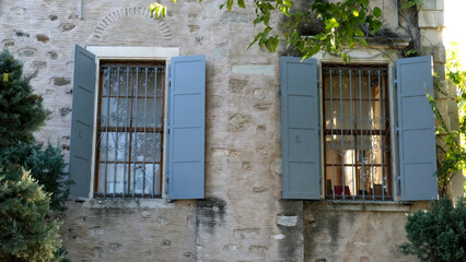 A beautiful window detail with blue shutters