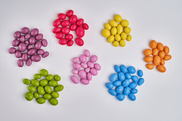 Multi-colored candies on a light background. Candy dragees. Candy background