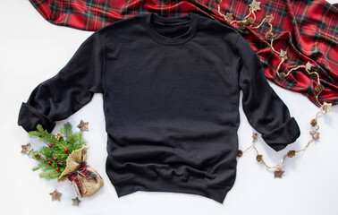 Close up black blank template sweatshirt hoodie with copy space and Christmas Holiday concept. Top...
