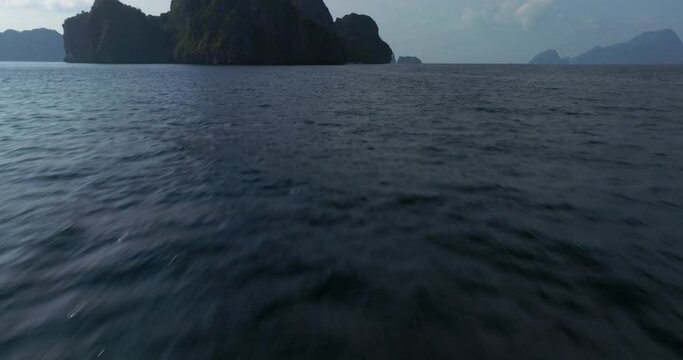 Drone view above the sea of a rock formation in El Nido, Palawan, Philippines