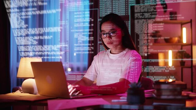 Portrait of asian Female Digital Entrepreneur Working on Computer. Line of Code Projected on His Face and Reflecting. App developer looking at hologram of machine learning data algorithm