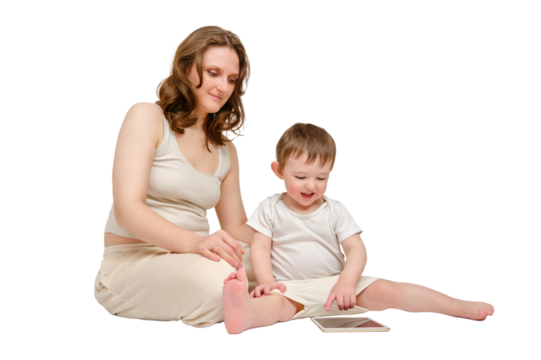 Happy baby with mother looking into digital tablet on studio, isolated on white background. Portrait of a smiling child with mom and playing on the tablet, isolated on white background.
