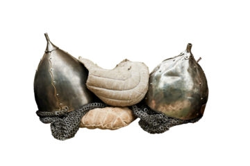 Medieval vintage armor and retro warrior helmet on board the ship, isolated on a white background. Reconstruction of the events of the Middle Ages in Europe.