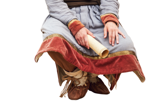 A man in vintage medieval clothes with a paper letter in his hand, isolated on a white background. Reconstruction of the events of the Middle Ages in Europe